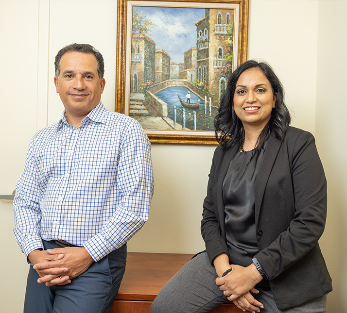 Doctor Vaziri and Doctor James smiling in Lorain endodontic office