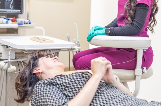 Woman leaning back in dental chair
