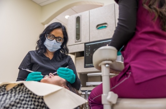 Doctor James performing root canal surgery on a Lorain dental patient