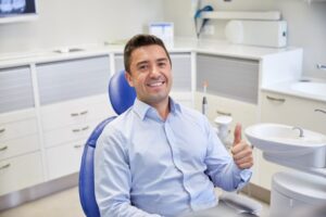 Man smiling after his root canal treatment