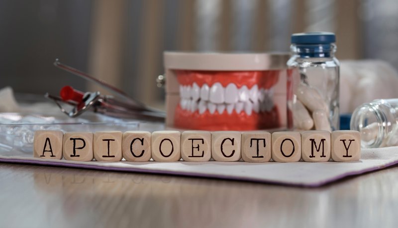 Wooden blocks of letters spelling out the word apicoectomy